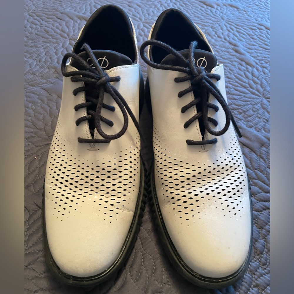 Cole Haan men’s white leather shoes with cushions  black sole . Very stylistic.